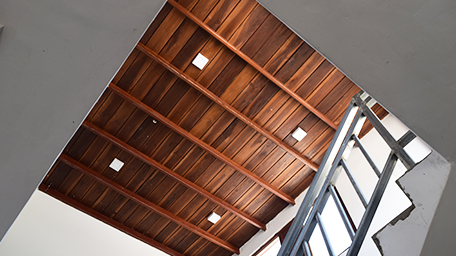 The house construction firm designs floor plans and sources the best affordable materials possible for its unique designs